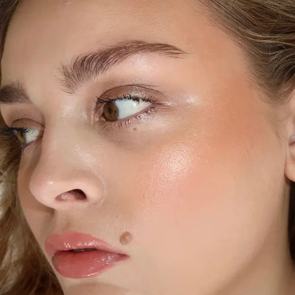 Ethical skincare glowing makeup look showcasing hydrated skin and luminous finish