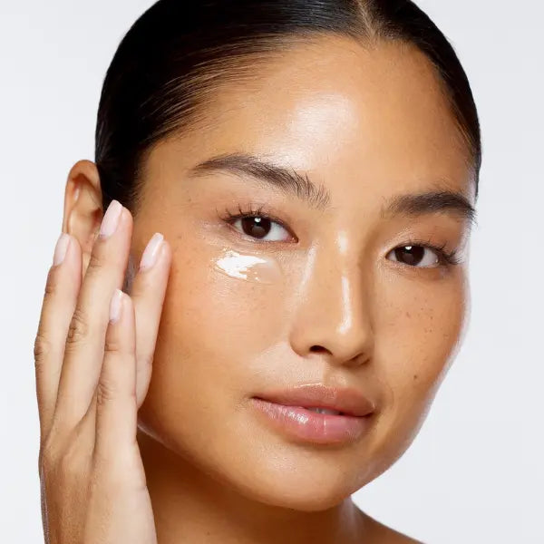 Solid serum applied under the eye for hydration and radiance on smooth, glowing skin