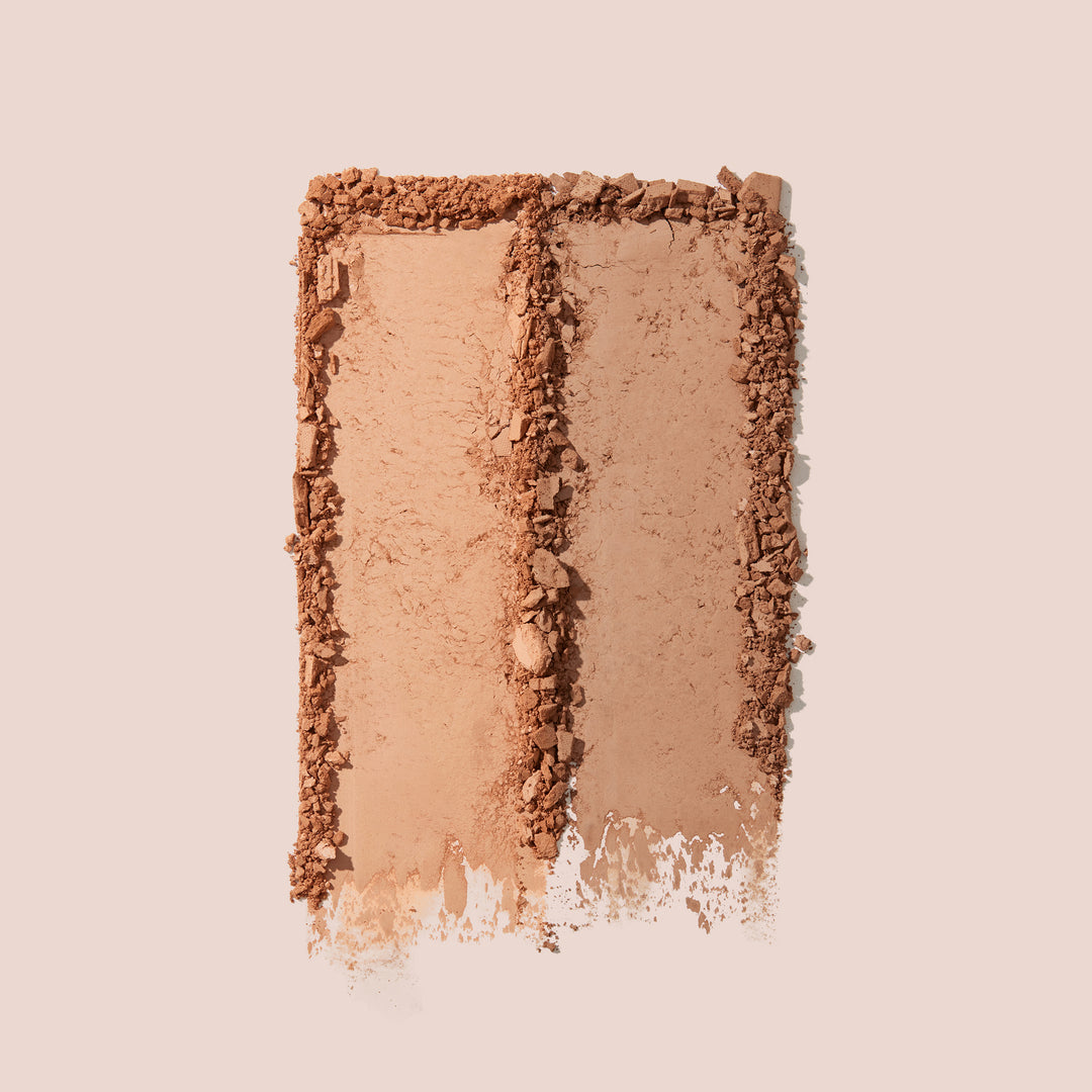 Vegan bronzer palette featuring two warm matte shades crushed and swatched on a soft beige background.