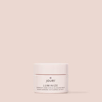 Jouer Luminize overnight dark circle slugging balm jar on pink background