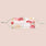 Reusable floral face mask with adjustable ear loops in soft pink and cream rose print.