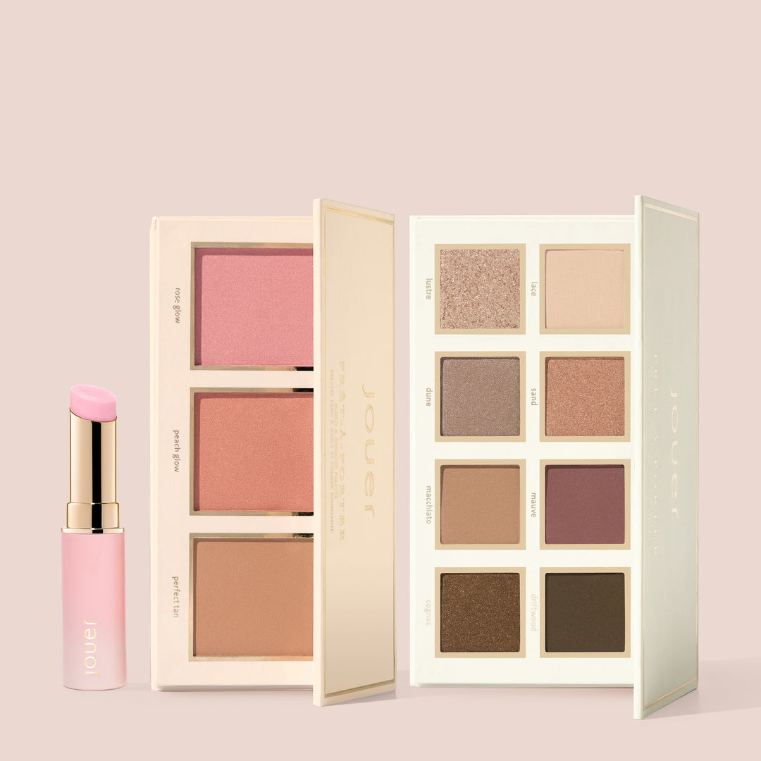 Ready to Wear set featuring a pH-adjusting pink lip balm alongside two open palettes: one with blush and bronzer shades, and one with neutral eyeshadow shades, displayed on a soft nude background.