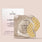 Jouer Dark Circles Correcting & Sleeping Eye Patch set, featuring three individual silver foil pouches with gold emblem patterned eye patches in front of a white product box on a solid pale pink background.