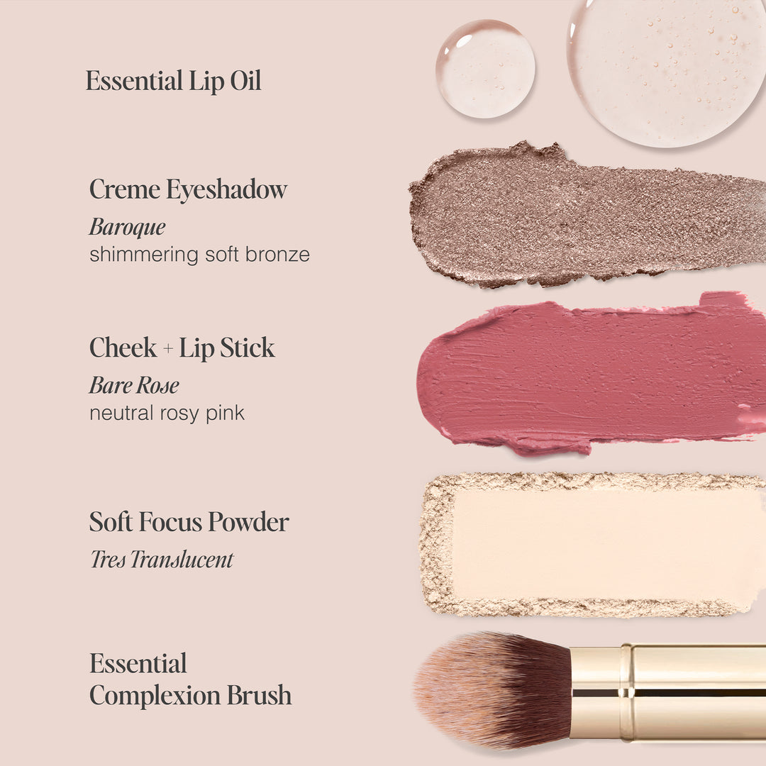 Flat lay image showcasing Jouer Cosmetics' 5 Minute Face collection, complete with product samples and labels. From top to bottom: Essential Lip Oil, Creme Eyeshadow in a shimmering soft bronze shade, Cheek + Lip Stick in a neutral rosy pink hue, Soft Focus Powder in light beige, and an Essential Complexion Brush. All items are gluten-free and cruelty-free.