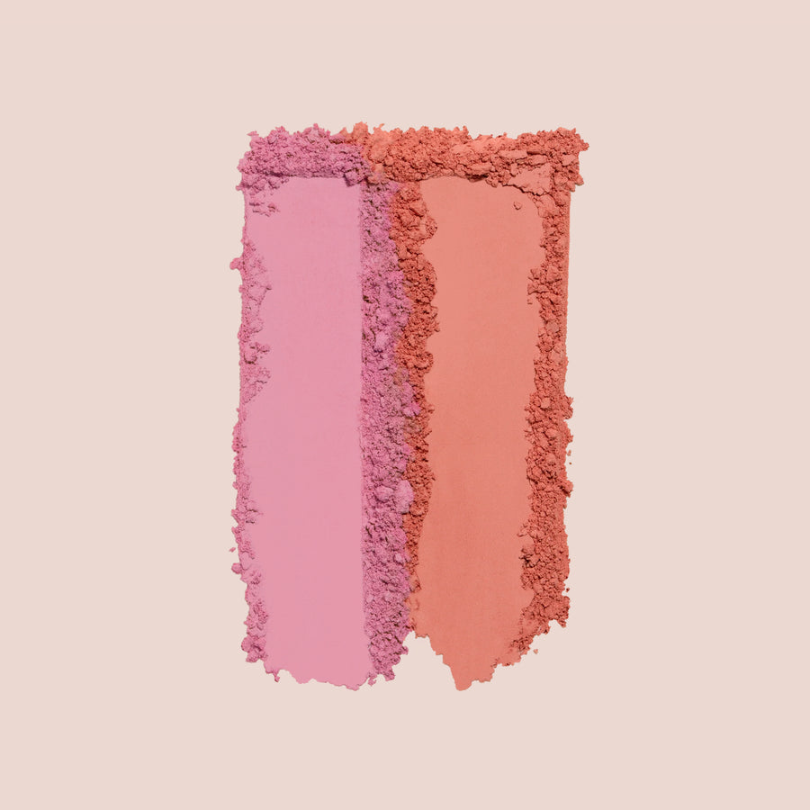 Two powder blush swatches in pink and coral tones from Blush Bouquet palette on neutral background