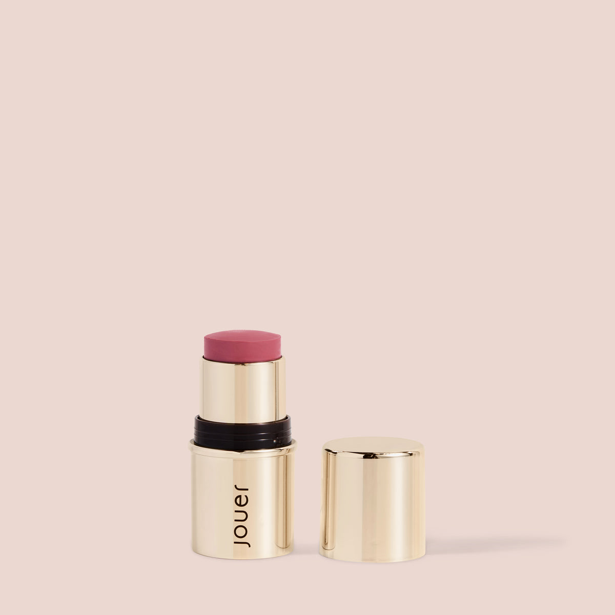 Rose blush lipstick in a sleek gold twist-up tube by Jouer, featuring a soft muted rose shade for cheeks and lips.