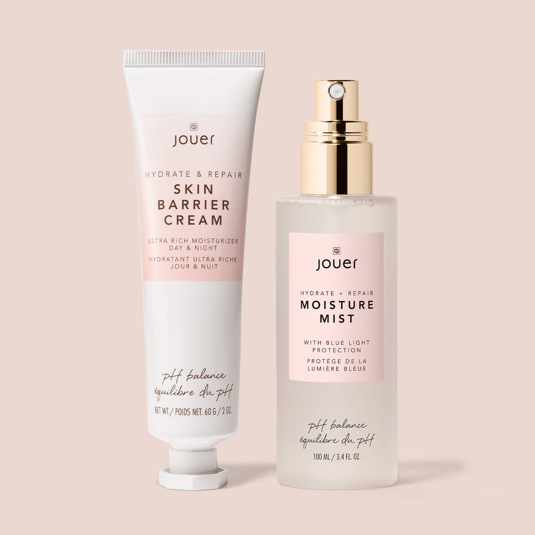 Two paraben-free skincare products from Jouer Cosmetics are shown against a light pink background. The left product is a tube labeled "Hydrate & Repair Skin Barrier Cream," while the right product is a spray bottle labeled "Hydrate & Repair Moisture Mist." Both labels indicate they are for hydration and repair.