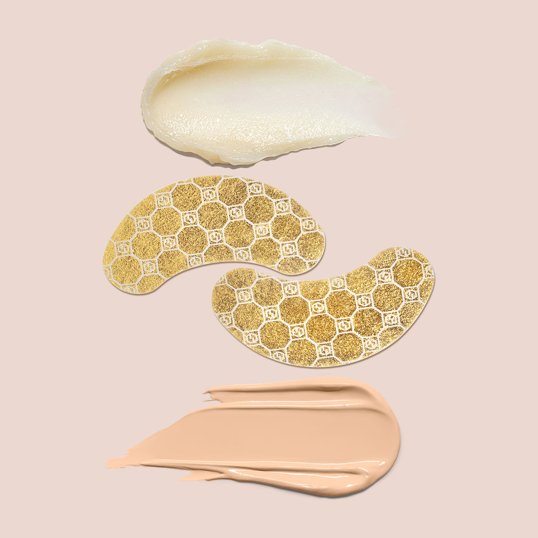 A beige background featuring three different samples from the Jouer Cosmetics Bright Eyes Set spread across it. At the top is a creamy white slugging balm, the middle displays two gold hexagon-patterned eye patches, and at the bottom is a swatch of beige cream.