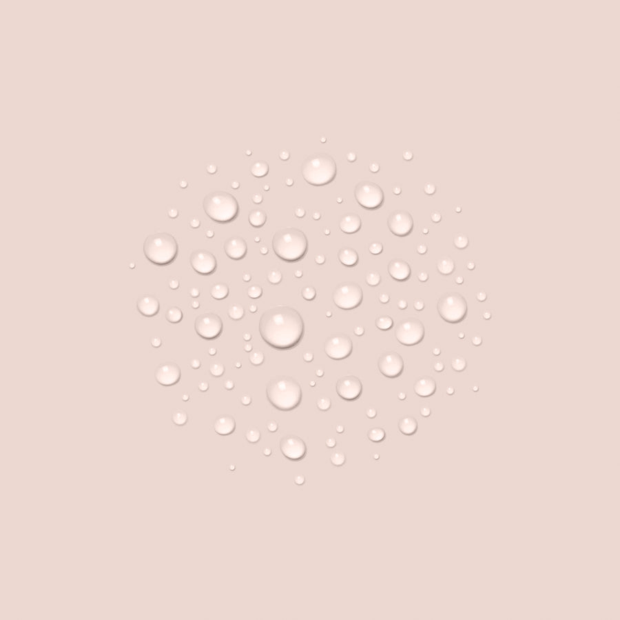 Clear water droplets on soft pink background representing hydrating face mist skincare product