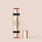 Jouer Blush & Bloom multi use blush stick in gold packaging with coral pink color, cap removed