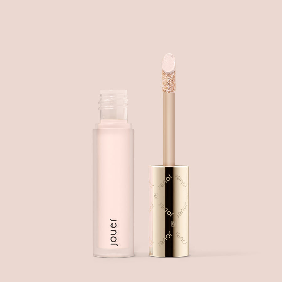 Jouer Essential liquid concealer tube with applicator wand open on pink background