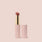 Jouer Balm Bouche vegan lip tint in pink tube with gold accent and burgundy color showing