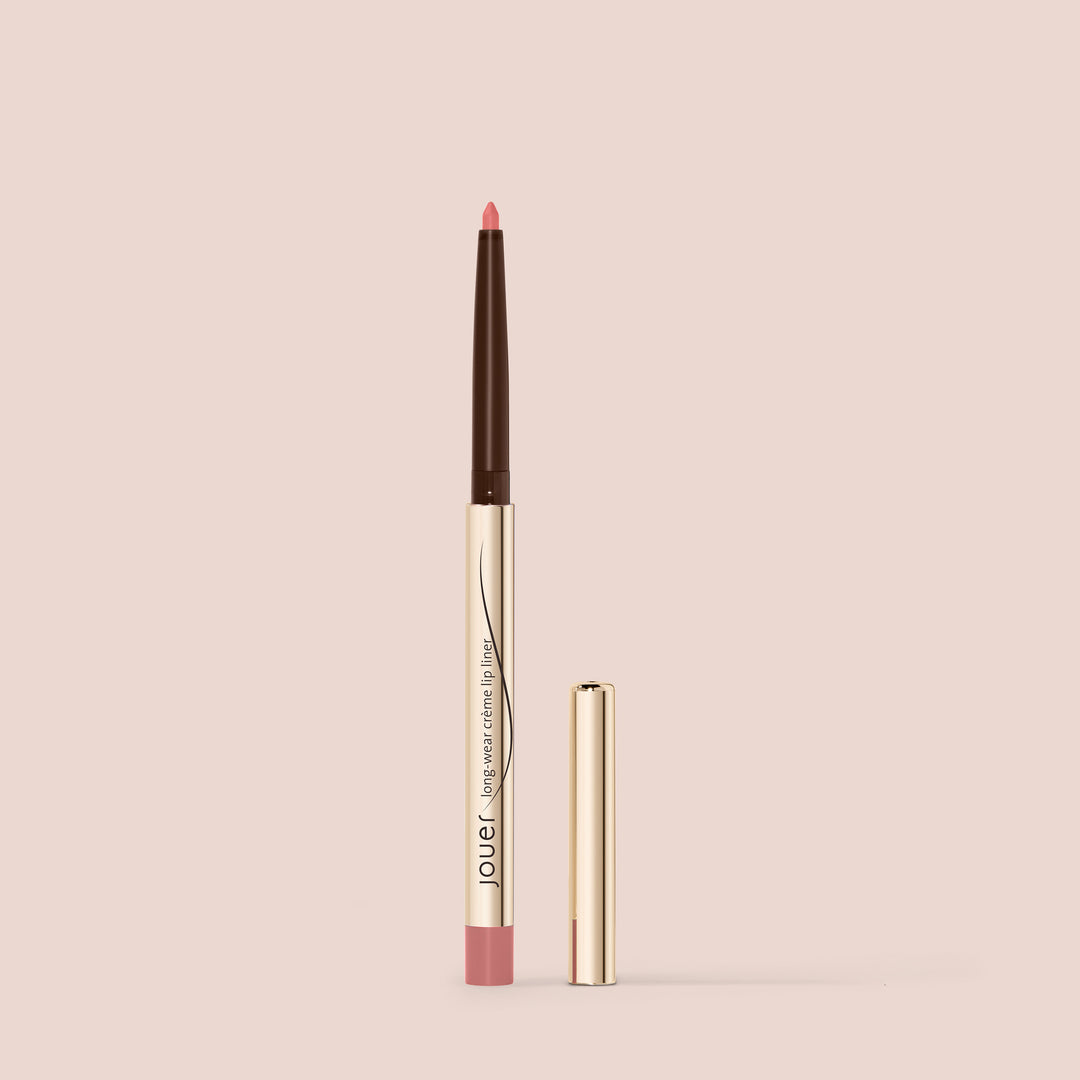 Rosy pink lip liner in a sleek gold tube with cap, shown against a soft nude background for a clean, elegant look.
