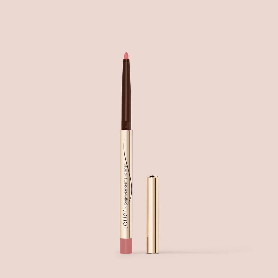 Rosy pink lip liner in a sleek gold tube with cap, shown against a soft nude background for a clean, elegant look.
