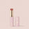 Pink Jouer Essential Shine Balm lip balm stick with gold accents and floral design, cap removed